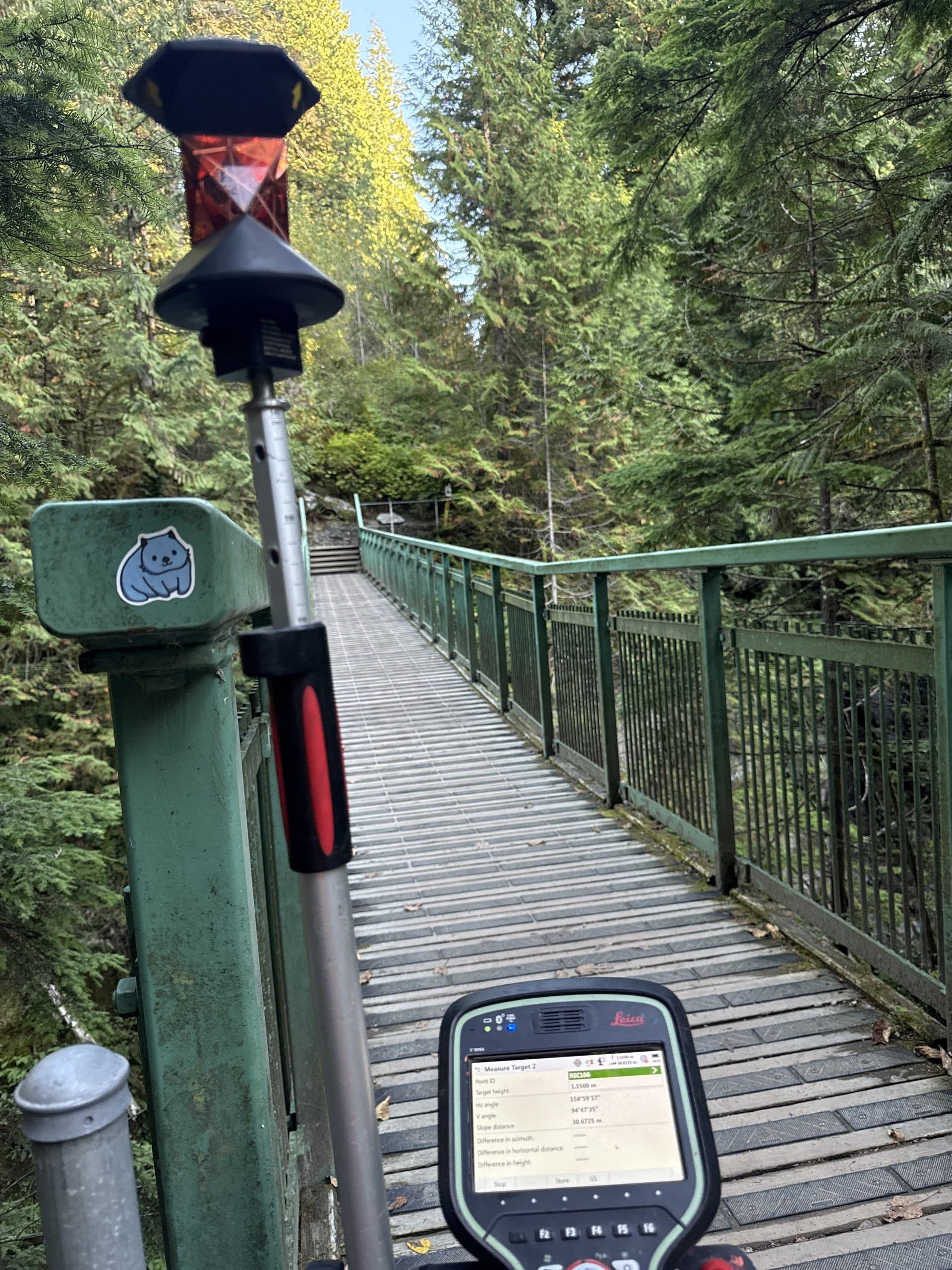 Prism target and field controller on a suspension footbridge