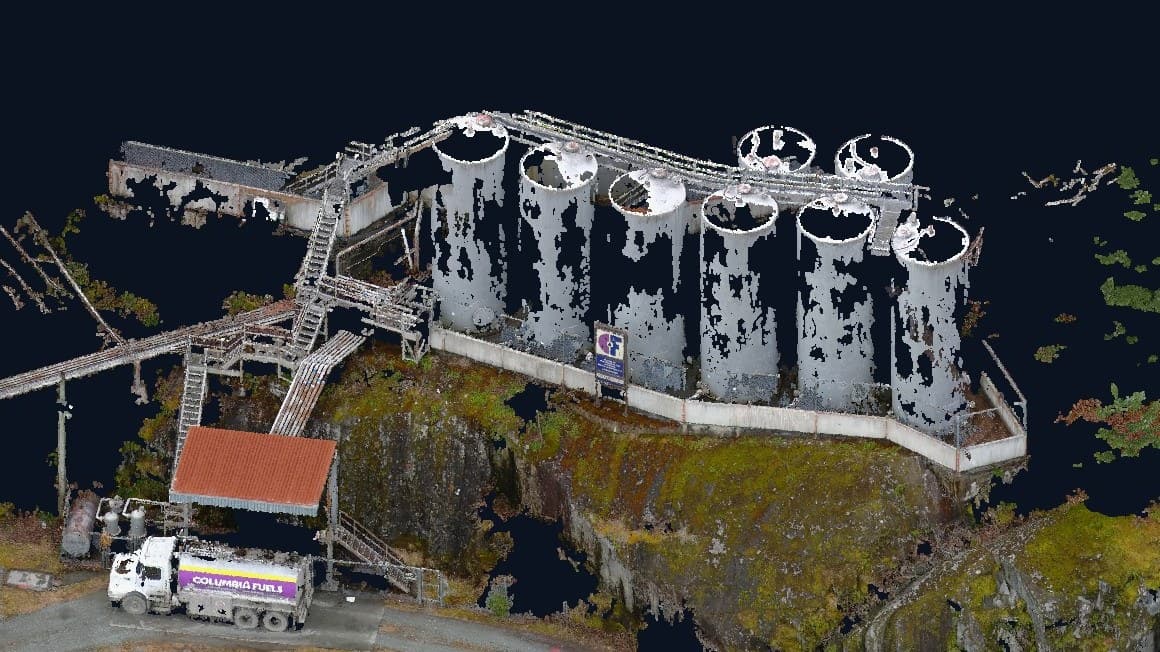 Colourized LiDAR point cloud of a fuel tank farm on a rock bluff above a highway